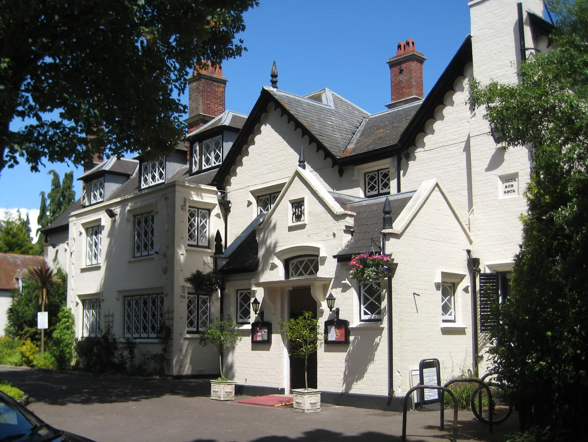 Traditional period property with white-painted brick and a gabled roofline